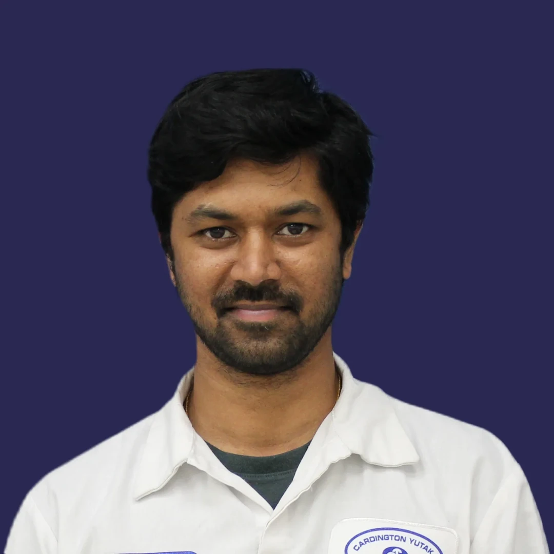 Male employee smiling.